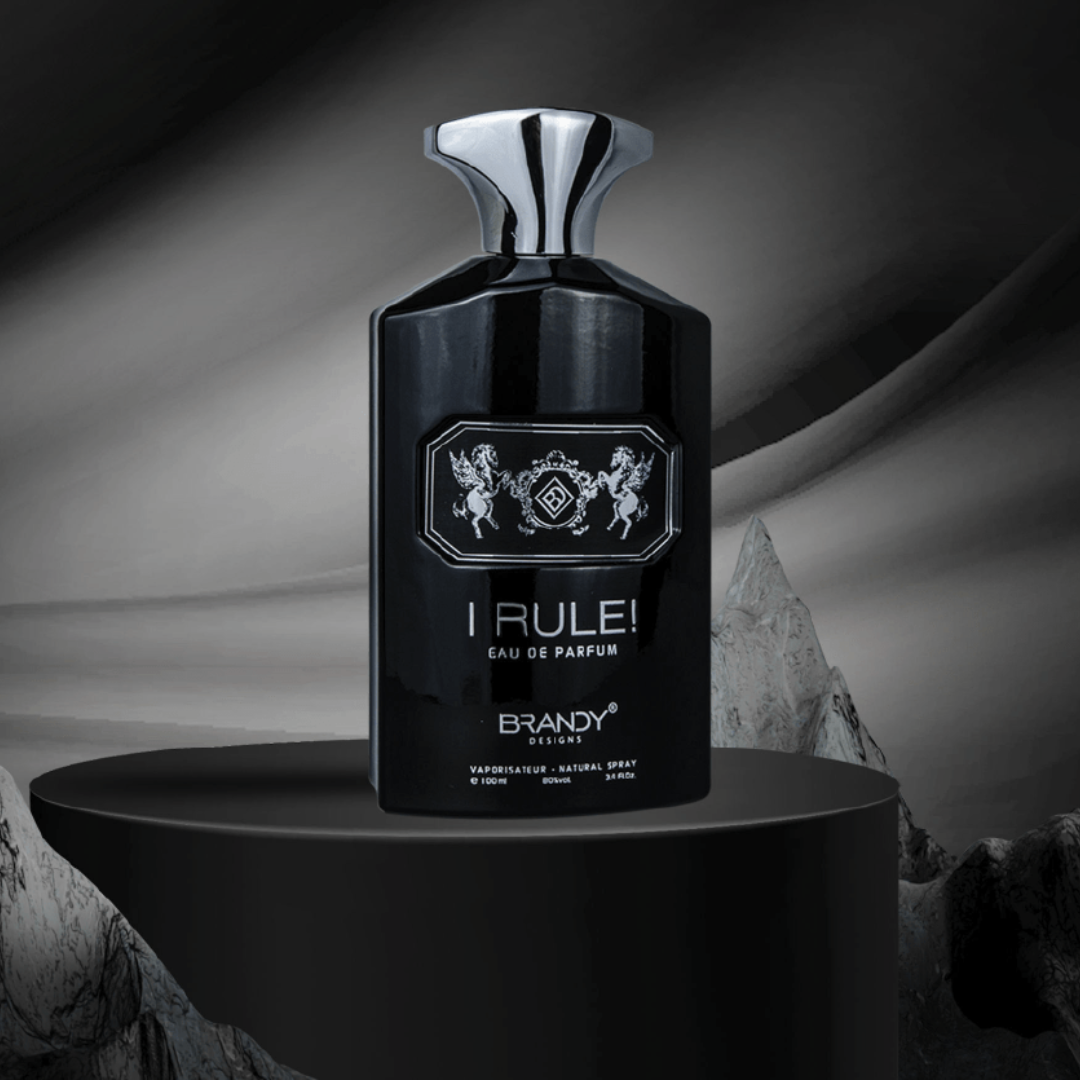 Black perfume bottle labeled 'I Rule!' on a dark background