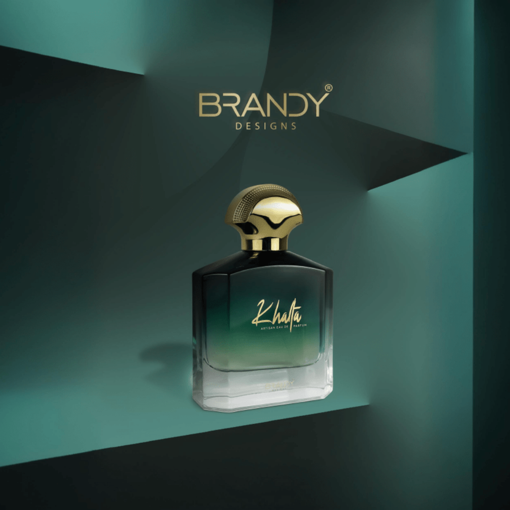 Perfume bottle with gold cap on a teal background, featuring the 'Brandy Designs' brand.
