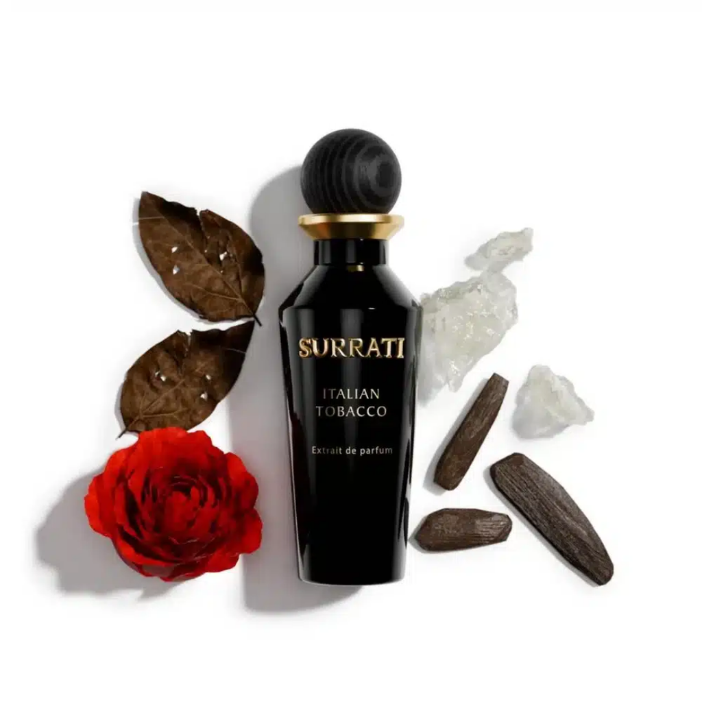 Surrati Italian Tobacco perfume bottle with a red rose and leaves on a white background