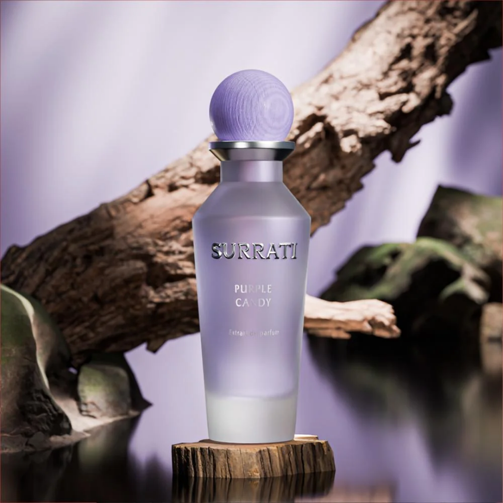 Surrati Purple Candy perfume bottle on a wooden stand with a natural background